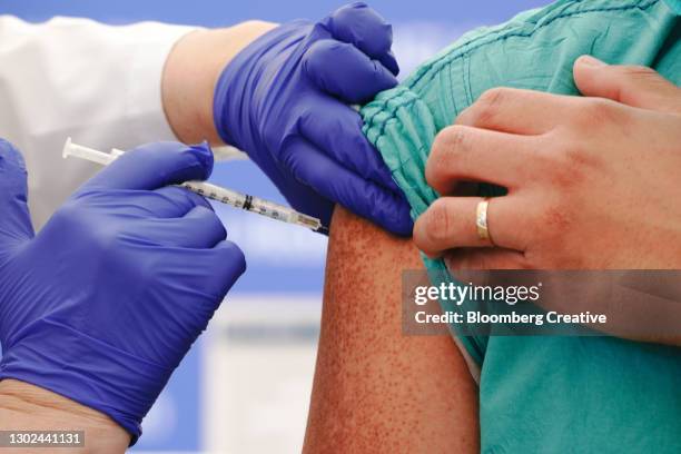 covid-19 vaccination - covid 19 vaccine stock pictures, royalty-free photos & images