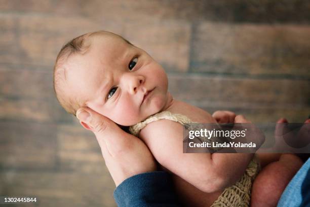 newborn baby looking cross eyed at camera - cross eyed stock pictures, royalty-free photos & images