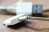 broken and frayed cable  charger for smart phones
