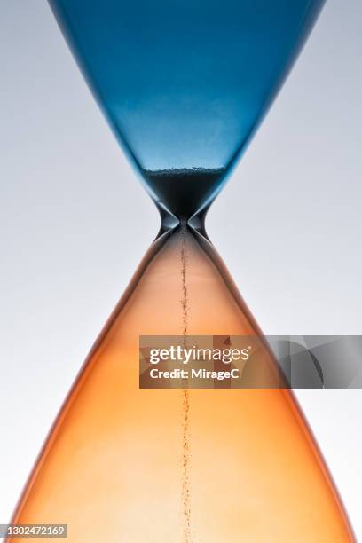 sand hourglass running out of time - hourglass stock pictures, royalty-free photos & images