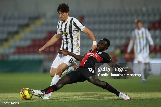 Theophilus Awua of Pro Vercelli slides in to challenge Filippo Ranocchia of Juventus during the Lega Pro Serie C match between Juventus U23 and Pro...
