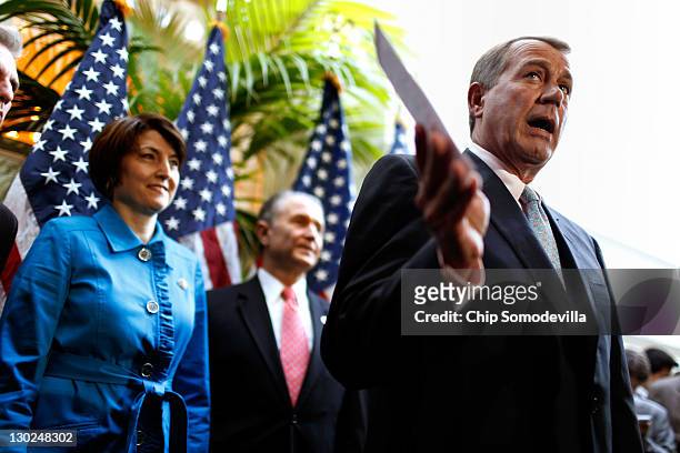 Speaker of the House John Boehner talks with reporters after a House Republican Caucus Meeting with Rep. Cathy McMorris Rodgers and Wally Herger at...