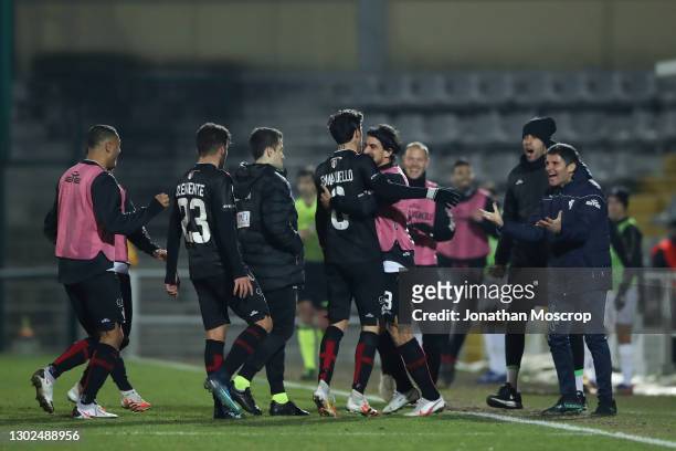 Simone Emmanuello of Pro Vercelli celebrates with team mates and staff after scoring to give the side a 2-0 lead during the Lega Pro Serie C match...