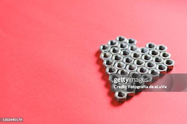 concept of love and romanticism - nut fastener stock-fotos und bilder