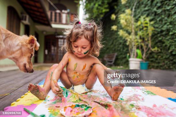 summer fun with a dog and acryl paint - small smart girl stock pictures, royalty-free photos & images