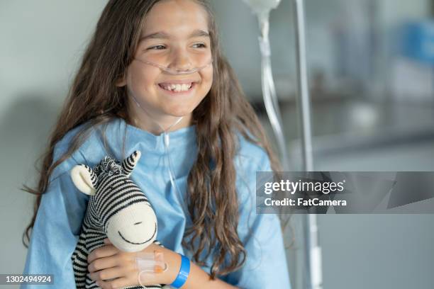 keeping my spirits up high - kids cancer smile stock pictures, royalty-free photos & images