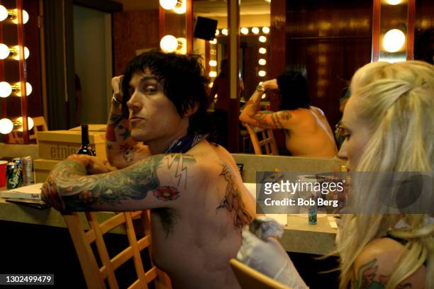 American singer-songwriter, musician, and record producer Butch Walker poses for a portrait in his dressing room while getting a tattoo on August 8,...