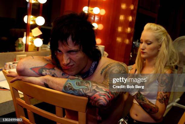 American singer-songwriter, musician, and record producer Butch Walker poses for a portrait in his dressing room while getting a tattoo on August 8,...