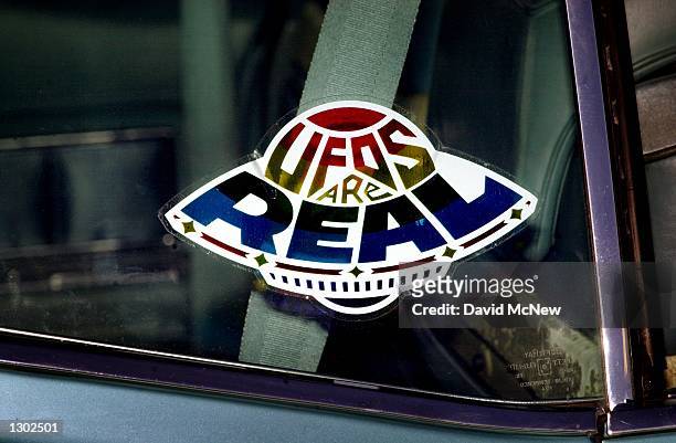 Sticker declares the existence of flying saucers from the window of a car parked on property near Jamul, CA, October 15 purchased by the Unarius...