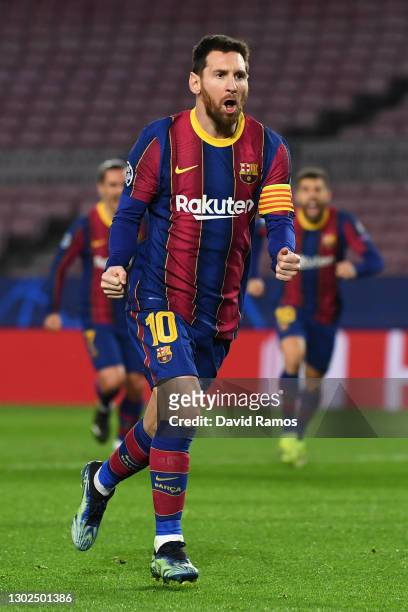 Lionel Messi of FC Barcelona celebrates after scoring their side's first goal during the UEFA Champions League Round of 16 match between FC Barcelona...