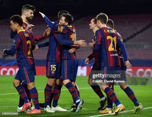 Lionel Messi of FC Barcelona celebrates with team mates Clement Lenglet and Gerard Pique after scoring their side's first goal during the UEFA...