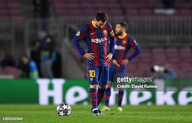 Lionel Messi of FC Barcelona reacts after conceding his side concedes their first goal during the UEFA Champions League Round of 16 match between FC...