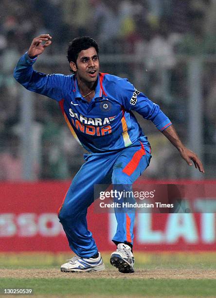Indian bowler Manoj Tiwary celebrates after taking his first International wicket of England batsman Tim Bresnan during 5th One Day International...