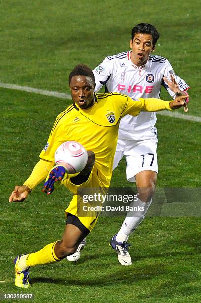 Pavel Pardo of the Chicago Fire and Emmanuel Ekpo of the Columbus Crew vie for the ball during an MLS match on October 22, 2011 at Toyota Park in...