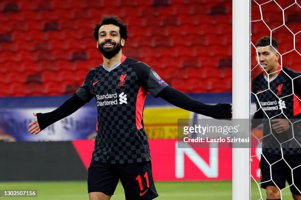 Mohamed Salah of Liverpool celebrates after scoring their side's first goal during the UEFA Champions League Round of 16 match between RB Leipzig and...