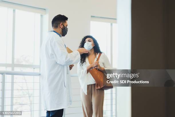 female patient talks with doctor - businesswoman mask stock pictures, royalty-free photos & images