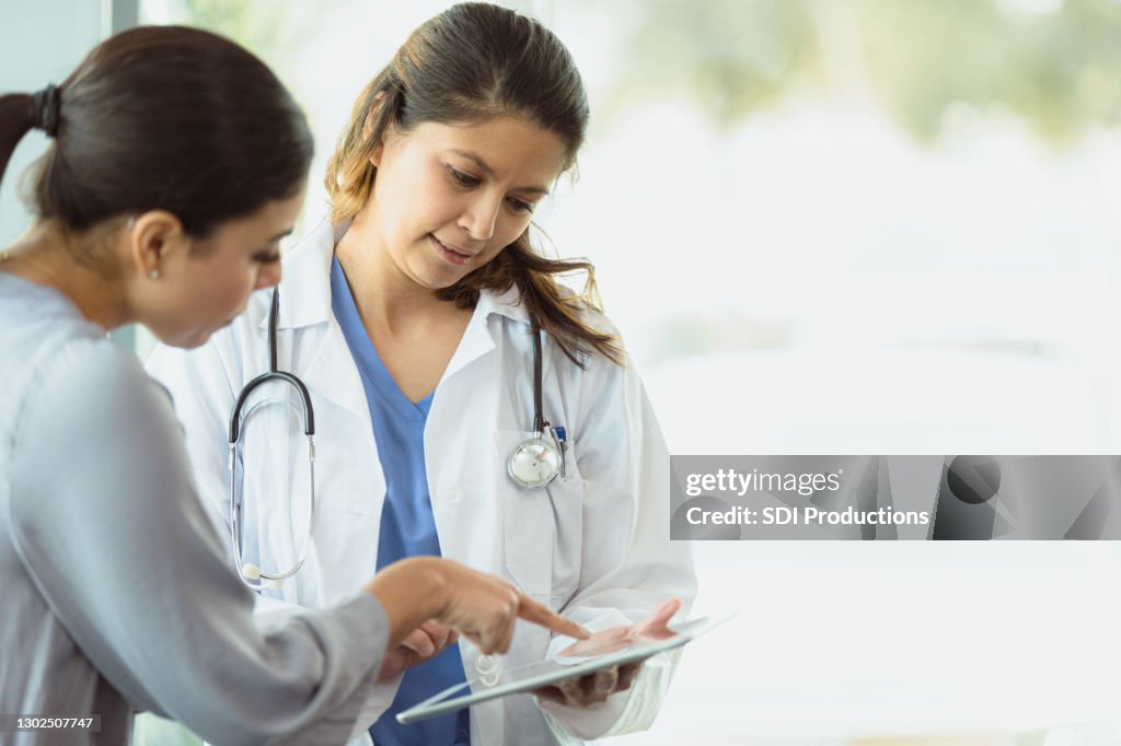 Attentive doctor discusses medical test result with patient