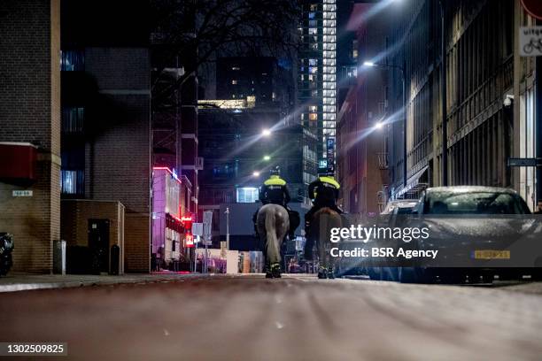 Mounted Police are seen in the city centre as the lockdown curfew stays in effect on February 16, 2021 in Rotterdam, Netherlands. Today the court...