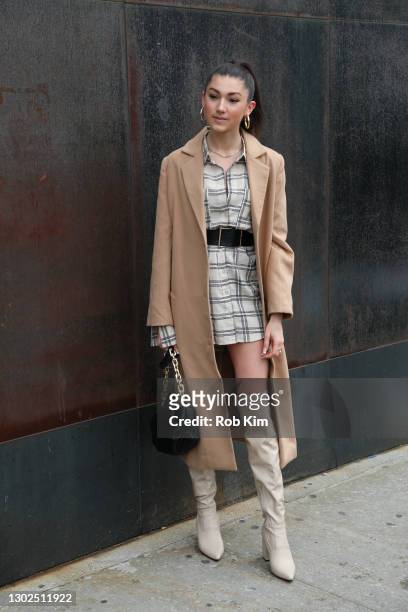 Kate Bartlett is seen wearing a long tan outside Rebecca Minkoff's Fall 2021 show during New York Fashion Week at Spring Studios on February 16, 2021...