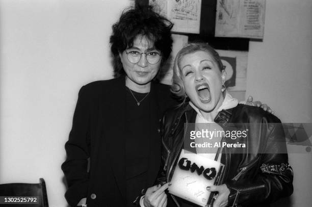 Yoko Ono autographs a copy of "Onobox" for Cyndi Lauper when they attend the release party for Yoko Ono's "Onobox" 6-CD career retrospective on...