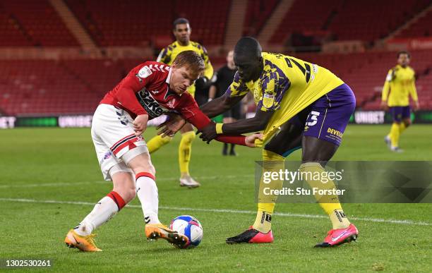 Boro player Duncan Watmore is challenged by Naby Sarr during the Sky Bet Championship match between Middlesbrough and Huddersfield Town at Riverside...