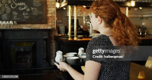 waitress carrying a tray of coffees - empregada de mesa imagens e fotografias de stock
