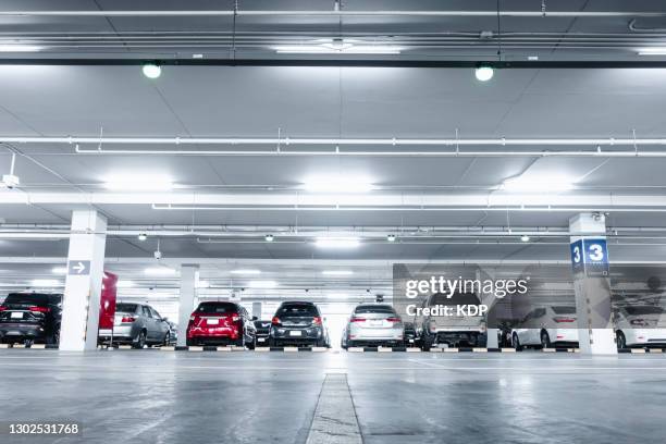 car parking lot in basement convenience shopping mall. - subterrâneo imagens e fotografias de stock