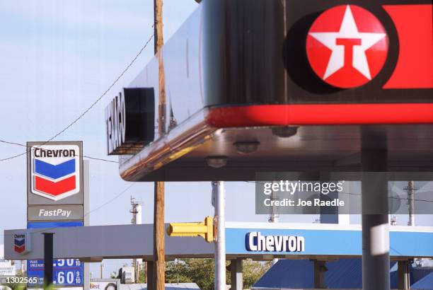Texaco gas station and a Chevron gas station share the same block October 16, 2000 in El Paso, Texas. Chevron Corp. And Texaco oil companies have...