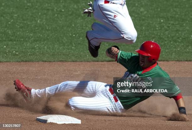 Cuban Erisbel Arruebarruena jumps after putting out on the second base Mexican Agustin Murillo during their match in the XVI Panamerican Games in...
