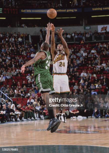 Desmond Mason, Small Forward and Shooting Guard for the Seattle SuperSonics attempts a 3 point jump shot as Paul Pierce of the Boston Celtics jumps...