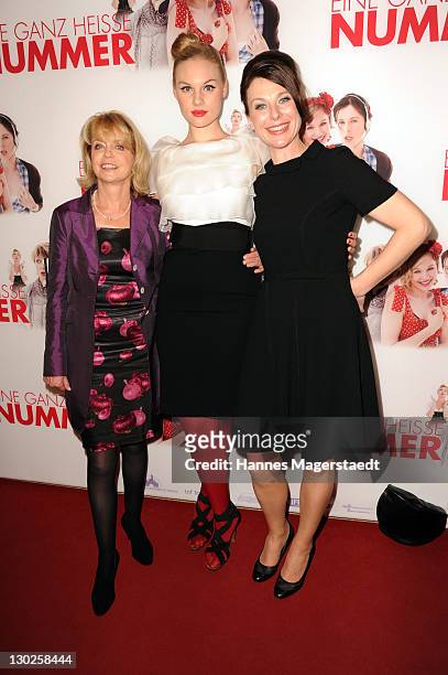 Actress Gisela Schneeberger, Rosalie Thomass and Bettina Mittendorfer attend "Eine Ganz Heisse Nummer" Germany premiere at the Mathaeser Filmpalast...