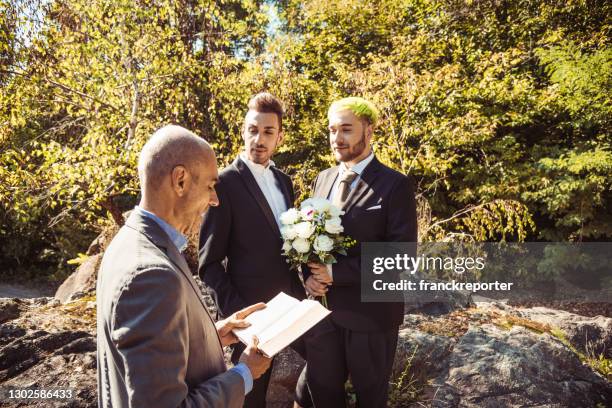 celebrating the marriage of a gay couple - civil partnership stock pictures, royalty-free photos & images