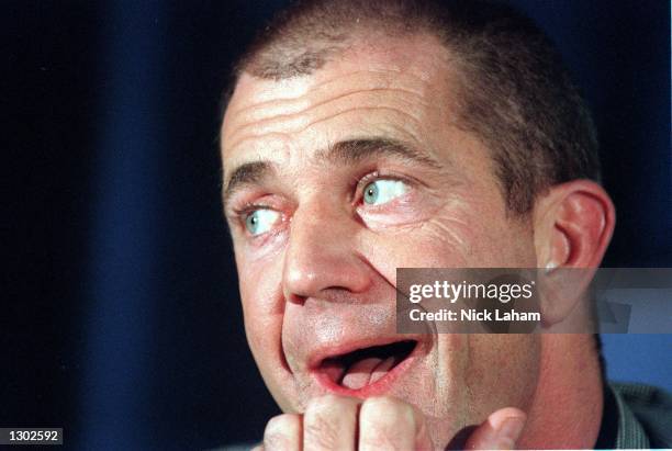 Actor Mel Gibson makes a gesture during a press conference to promote his new movie "What Women Want" October 17, 2000 at the Intercontinental Hotel...