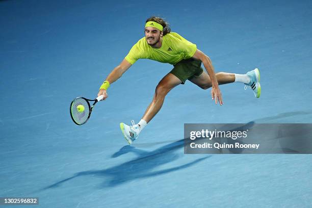 Stefanos Tsitsipas of Greece plays a forehand during his Men’s Singles Quarterfinals match against Rafael Nadal of Spain during day 10 of the 2021...