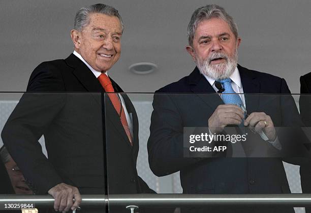 Former Brazilian President Luiz Inacio Lula Da Silva prepares to deliver his speech next to the president of the Mexico Business Summit 2011, Miguel...