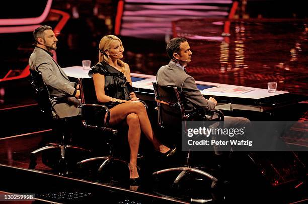 Jury members Mirko Bogojevic, Sarah Connor and Till Broenner during 'The X Factor Live' TV-Show on October 25, 2011 in Cologne, Germany.