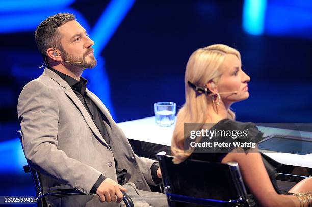Jury members Mirko Bogojevic and Sarah Connor during 'The X Factor Live' TV-Show on October 25, 2011 in Cologne, Germany.
