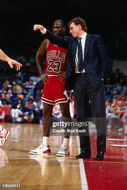 Chicago Bulls head coach Doug Collins talks with Michael Jordan against the Los Angeles Clippers during a game played circa 1987 at the LA Sports...