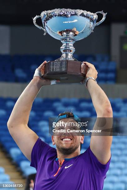 Dylan Alcott of Australia poses with the championship trophy after winning his Quad Wheelchair Singles Final match against Sam Schroder of the...