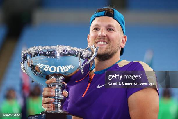 Dylan Alcott of Australia poses with the championship trophy after winning his Quad Wheelchair Singles Final match against Sam Schroder of the...