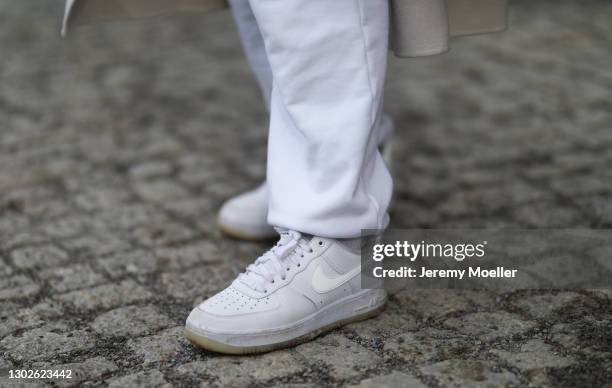 Anna Winter wearing Nike white jogging pants and white AirForce sneaker on February 15, 2021 in Berlin, Germany.