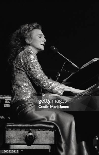 Judy Collins sings and plays the piano with the Cheyenne Symphony Orchestra at the Cheyenne Civic Center on November 3, 1984 in Cheyenne, Wyoming....