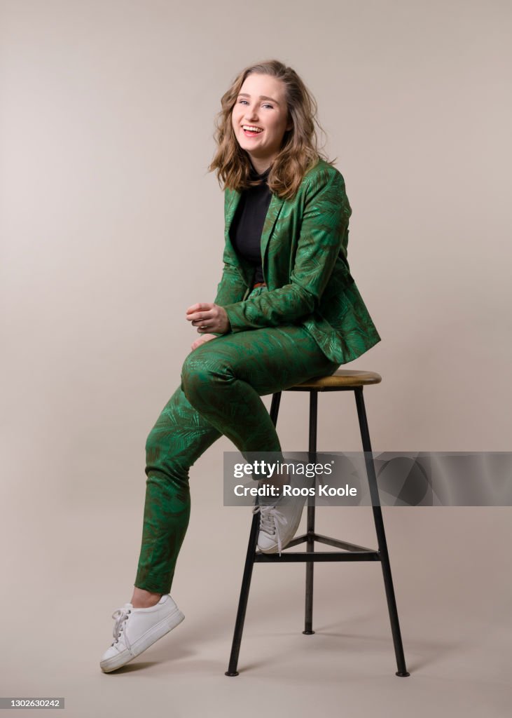 Young woman on a stool