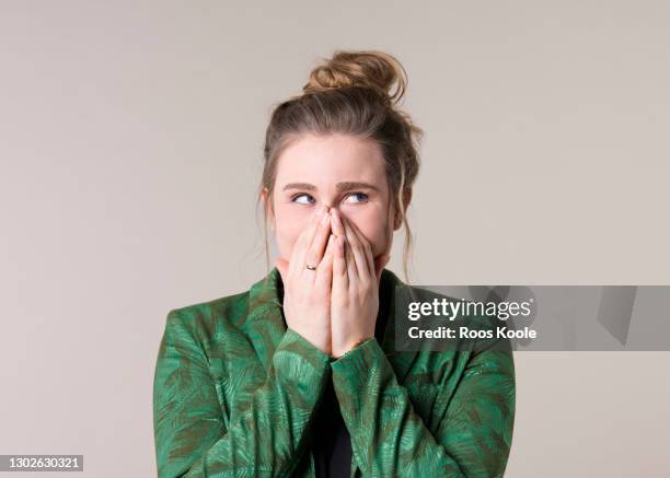 young woman in studio - disbelief woman face foto e immagini stock