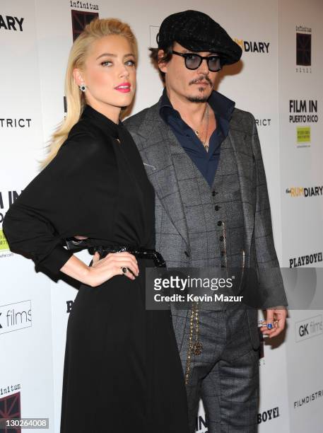 Amber Heard and Johnny Depp attend the "The Rum Diary" New York premiere at the Museum of Modern Art on October 25, 2011 in New York City.