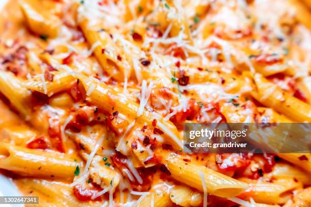 penne pasta alla vodka italian dinner - parmesan cheese overhead stock pictures, royalty-free photos & images