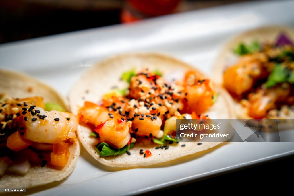 A Platter With Three Gourmet Shrimp Tacos With Mango Habanero Salsa