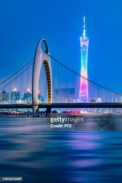 guangzhou canton tower with bridge at night - canton tower stock pictures, royalty-free photos & images