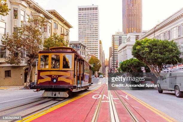 historic cable car on the street in san francisco, usa - san francisco californië stockfoto's en -beelden