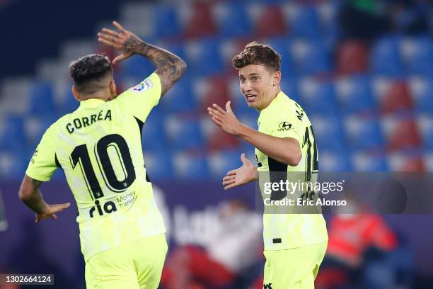 Marcos Llorente of Atletico de Madrid celebrates with Angel Correa after scoring his team's first goal during the La Liga Santander match between...